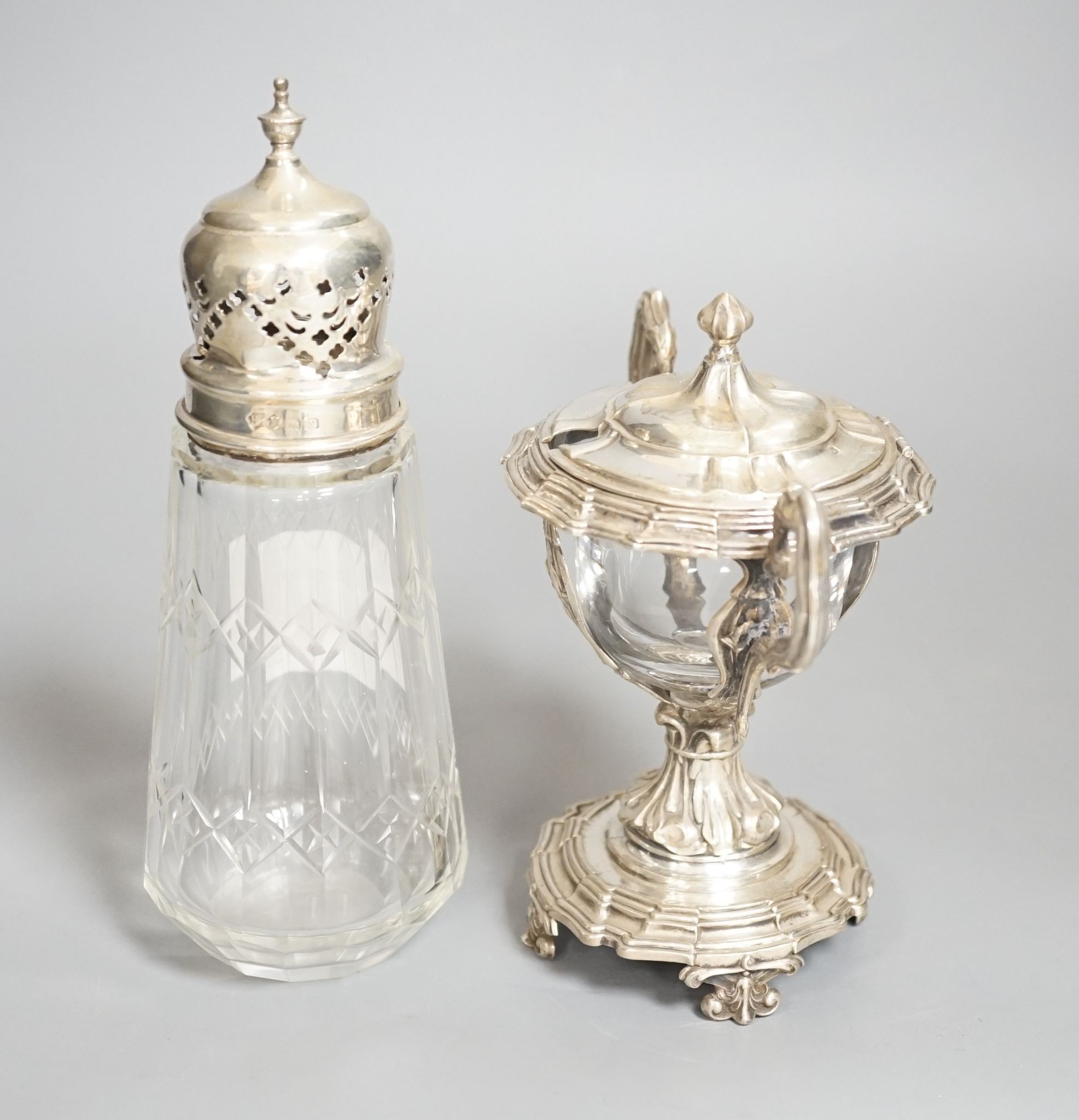 A George V silver mounted glass caster and a continental silver mustard pot frame (the latter a.f)